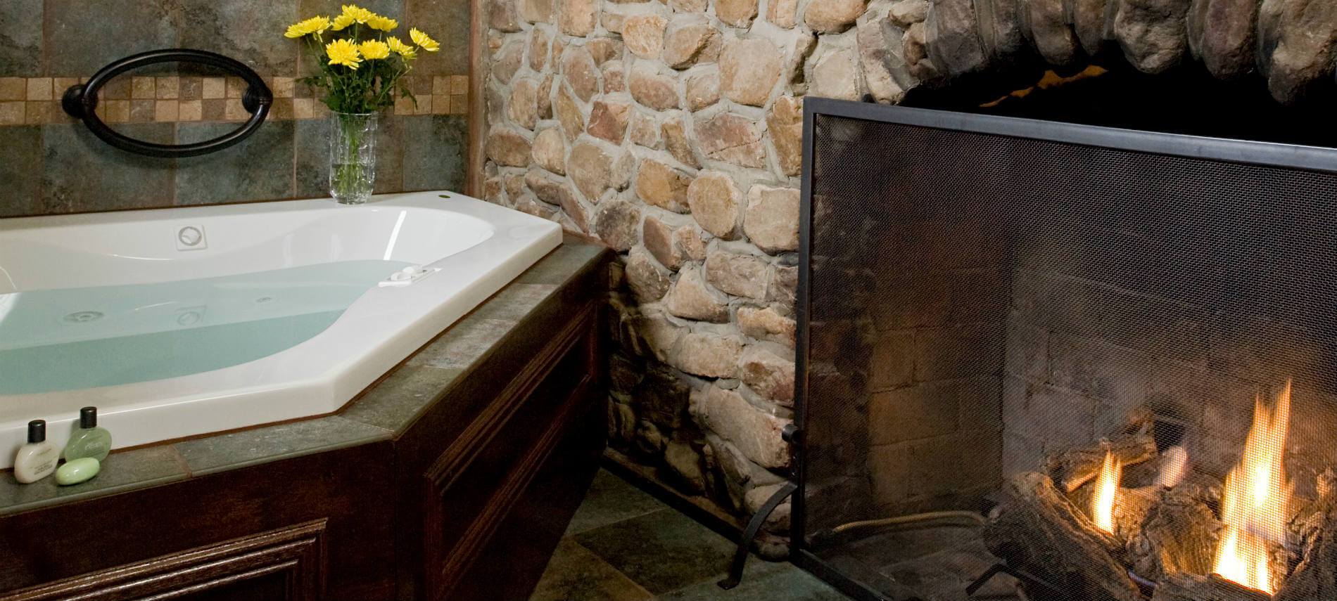 Picture of the tub and fireplace.